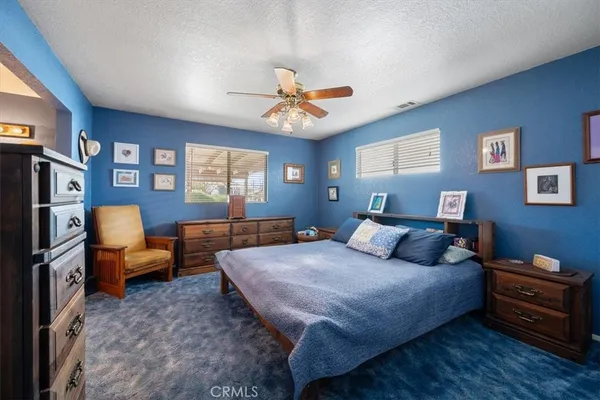 a bedroom with a bed and furniture