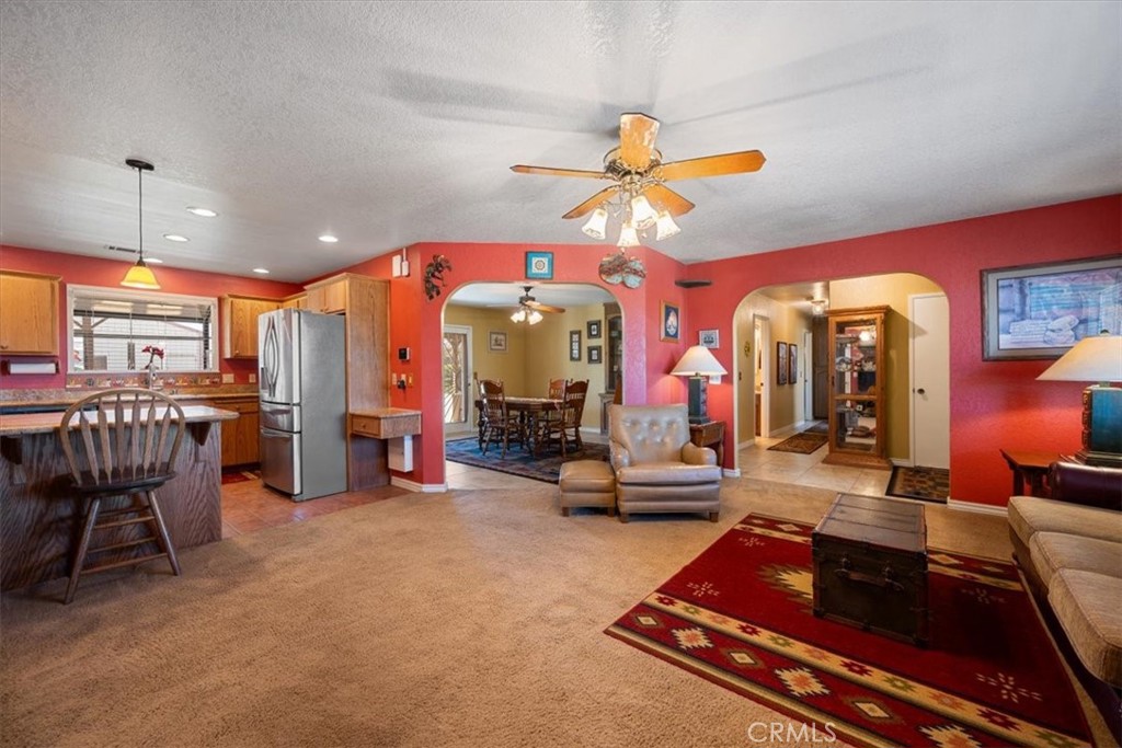 2100 Starkey Road Shandon, CA 93461 - Photo 10 of 39 a room with lots of gym equipment and a chandelier