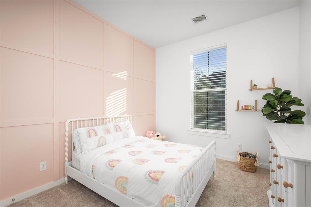 817 Isabel Street Celina, TX 75009 - Photo 15 of 39 a bedroom with a bed and a window