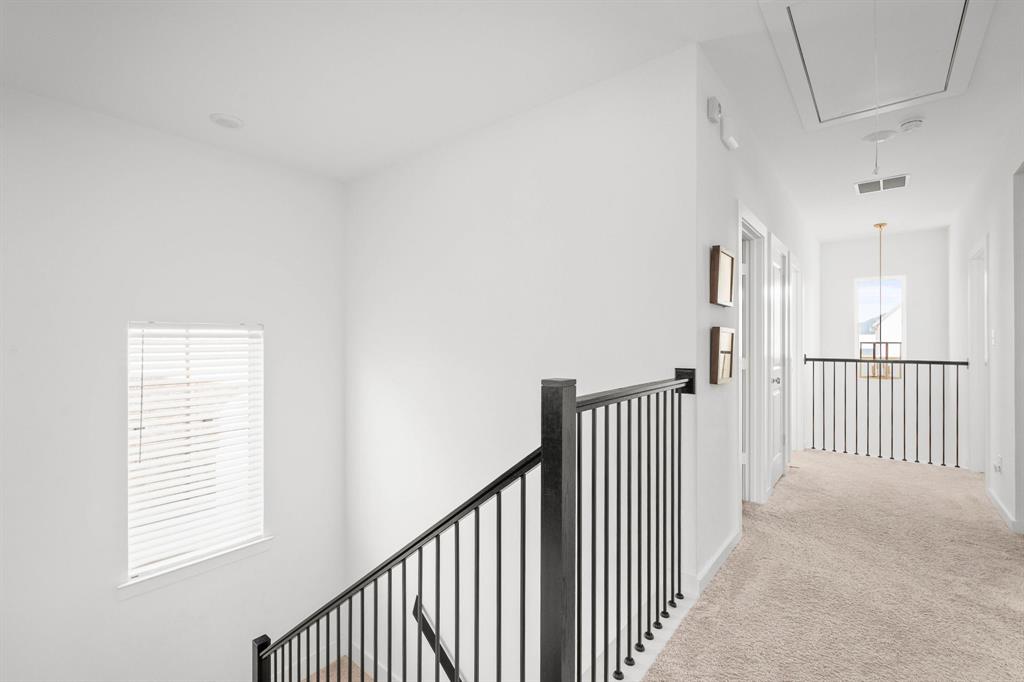 817 Isabel Street Celina, TX 75009 - Photo 17 of 39 a view of a hallway with a window