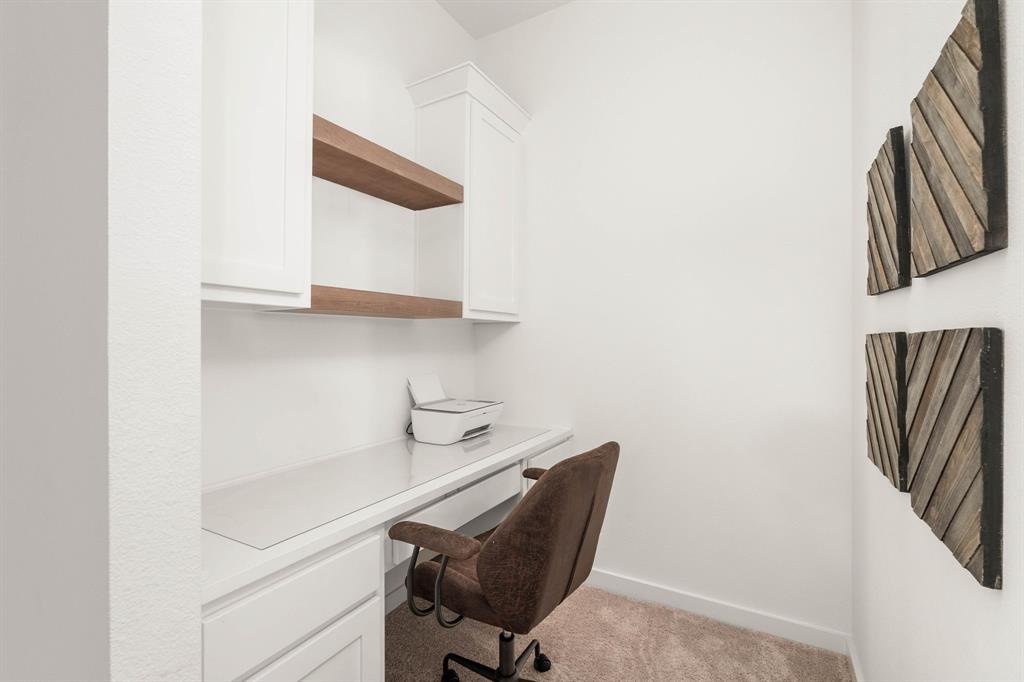 817 Isabel Street Celina, TX 75009 - Photo 22 of 39 a view of walk in closet with clothes and shoes