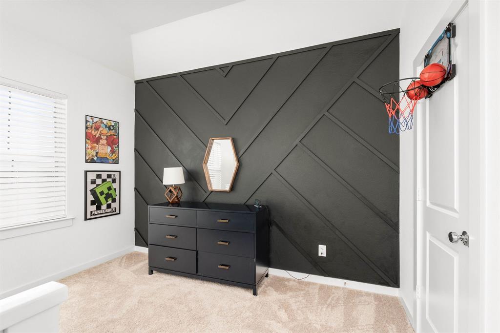 817 Isabel Street Celina, TX 75009 - Photo 23 of 39 a bedroom with a bed and a dresser