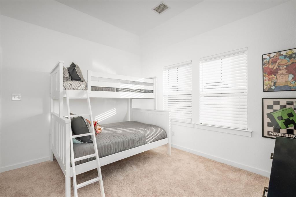 817 Isabel Street Celina, TX 75009 - Photo 25 of 39 a bedroom with a bed and a window