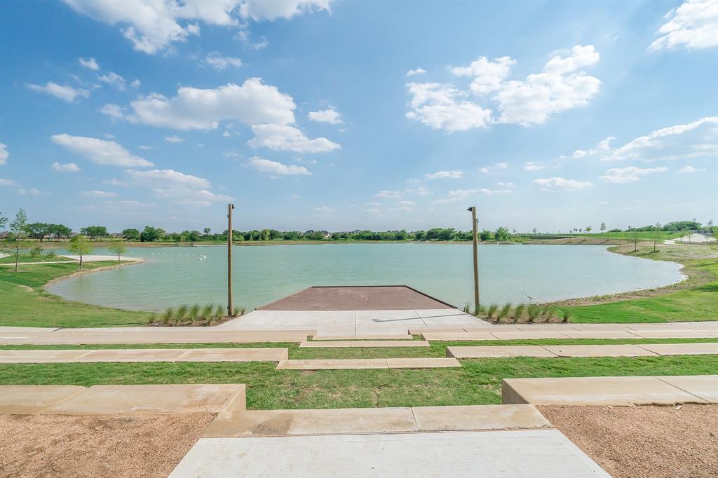 817 Isabel Street Celina, TX 75009 - Photo 37 of 39 a view of a lake and a yard