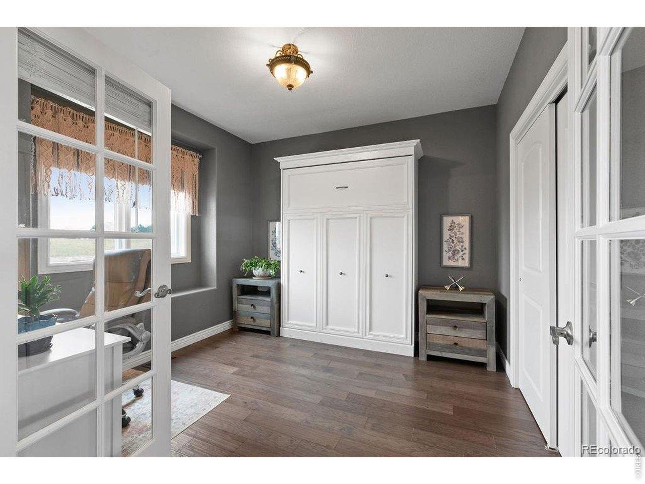 3050 Native Court Wellington, CO 80549 - Photo 11 of 50 Work from home by day, guest space by night with this front office featuring a Murphy bed