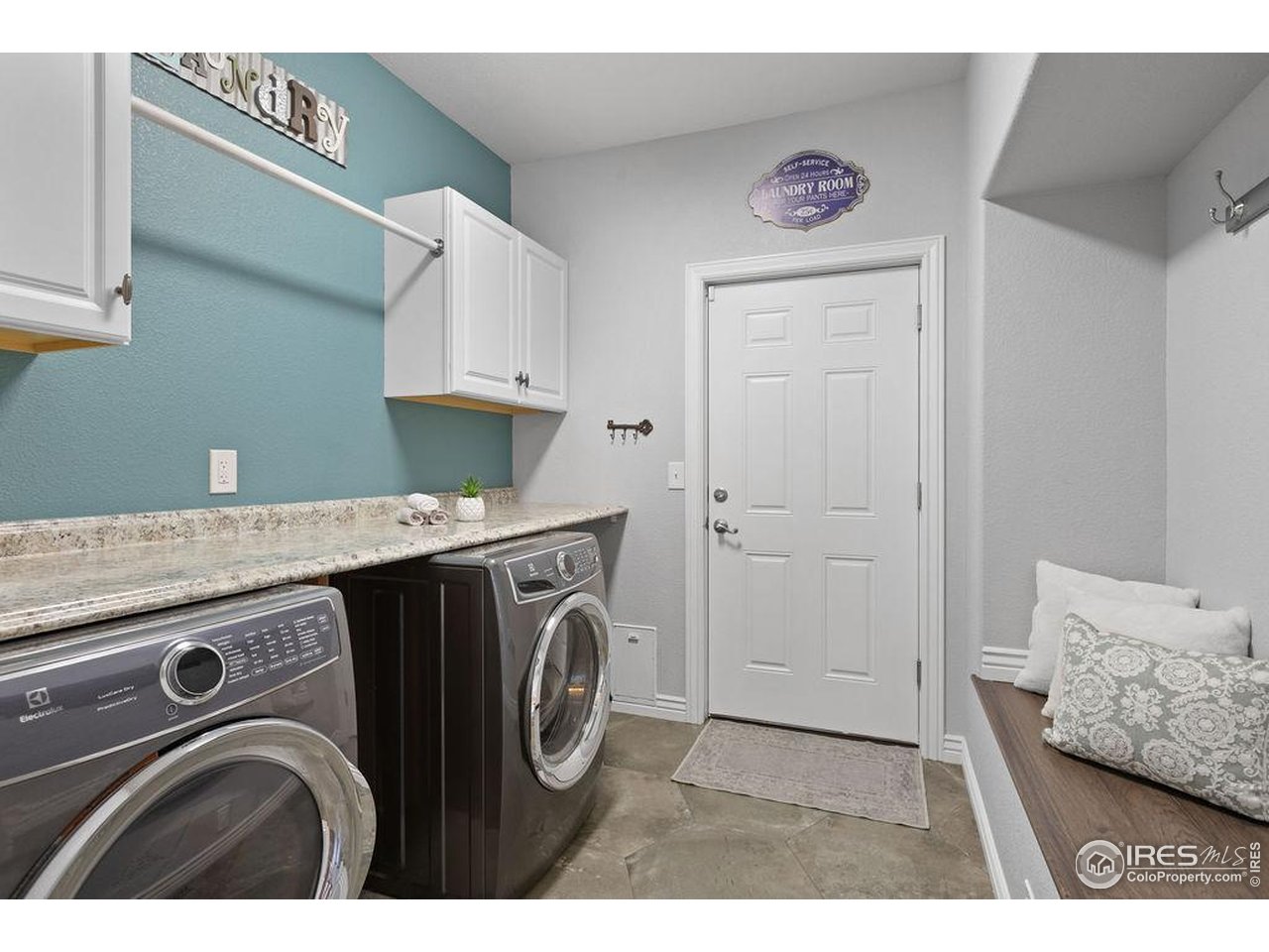 3050 Native Court Wellington, CO 80549 - Photo 41 of 50 Laundry & Mudroom Directly Off of Garage. Dog Doors Allowing Travel from House to Cedar Fenced Kennel