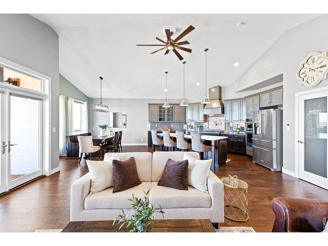 3050 Native Court Wellington, CO 80549 - Photo 6 of 50 Expansive open concept design connecting kitchen, dining, and living spaces effortlessly