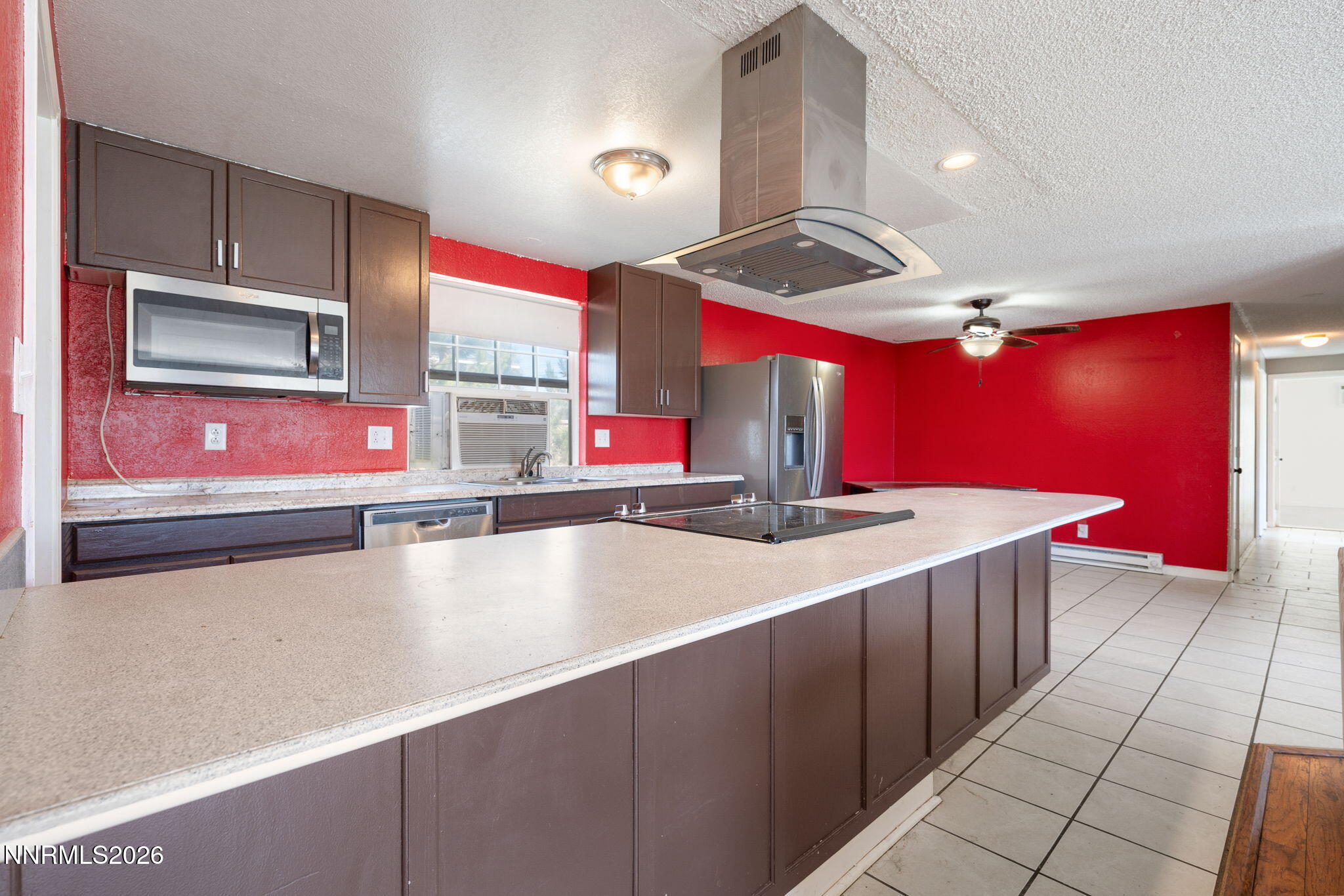 3590 Siskin Lane Reno, NV 89508 - Photo 8 of 31 a kitchen with stainless steel appliances a sink and dishwasher a oven with wooden cabinets