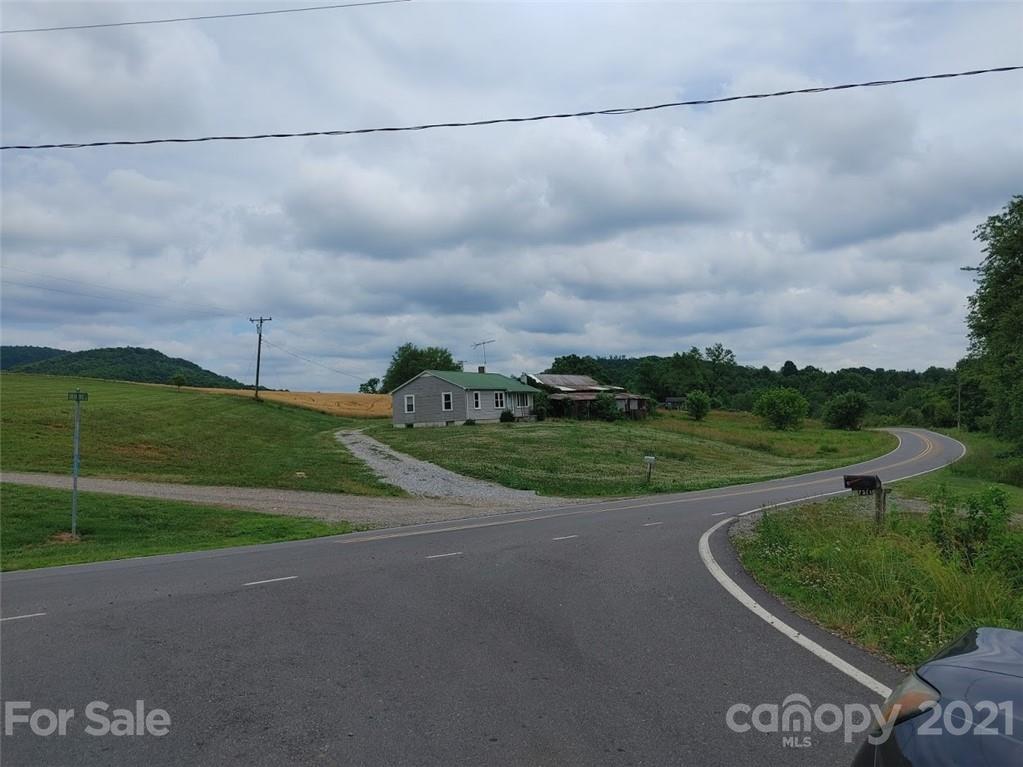 7312 Cheatham Ford Road Hiddenite, NC 28636 - Photo 2 of 16 a view of a big yard with potted plants
