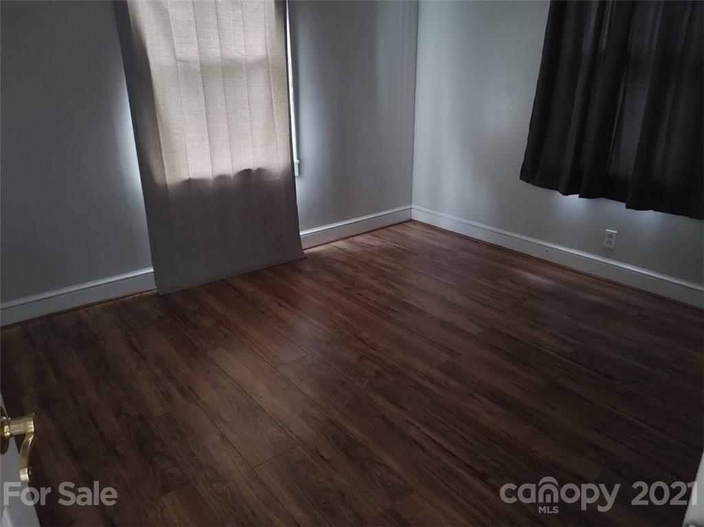 7312 Cheatham Ford Road Hiddenite, NC 28636 - Photo 13 of 16 an empty room with wooden floor