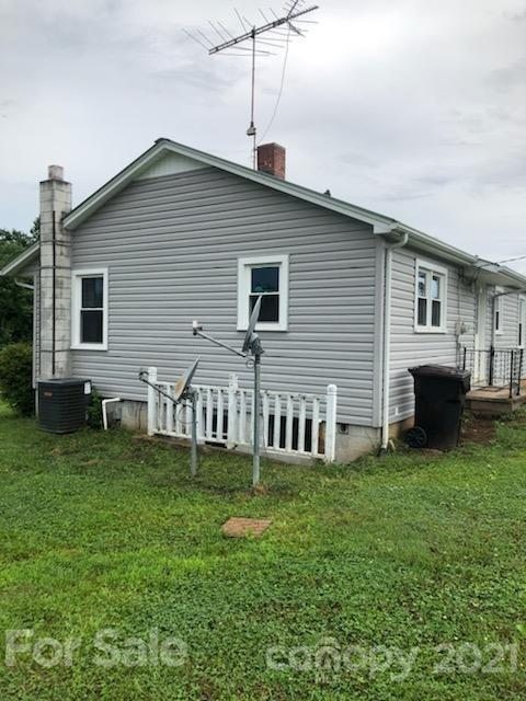 7312 Cheatham Ford Road Hiddenite, NC 28636 - Photo 6 of 16 a front view of house with a garden