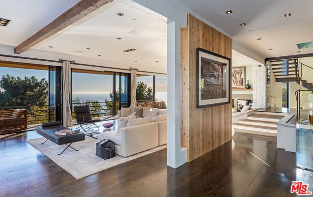 a view of a living room and dining room