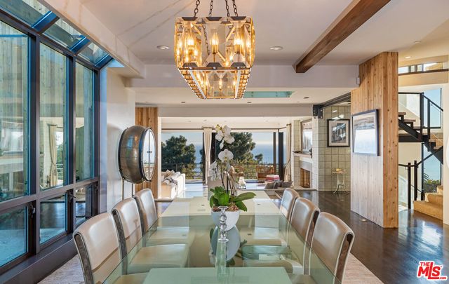 a view of a dining room with furniture wooden floor and chandelier