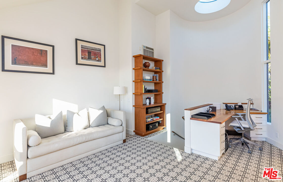 3900 Villa Costera Malibu, CA 90265 - Photo 25 of 43 a living room with furniture and a gym machine
