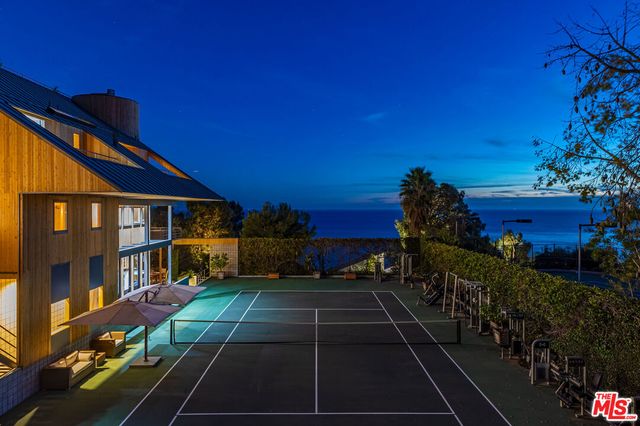 a view of a balcony with a potted plants