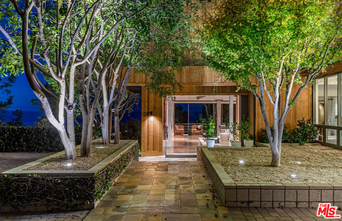 3900 Villa Costera Malibu, CA 90265 - Photo 6 of 43 a view of a house with backyard porch and sitting area