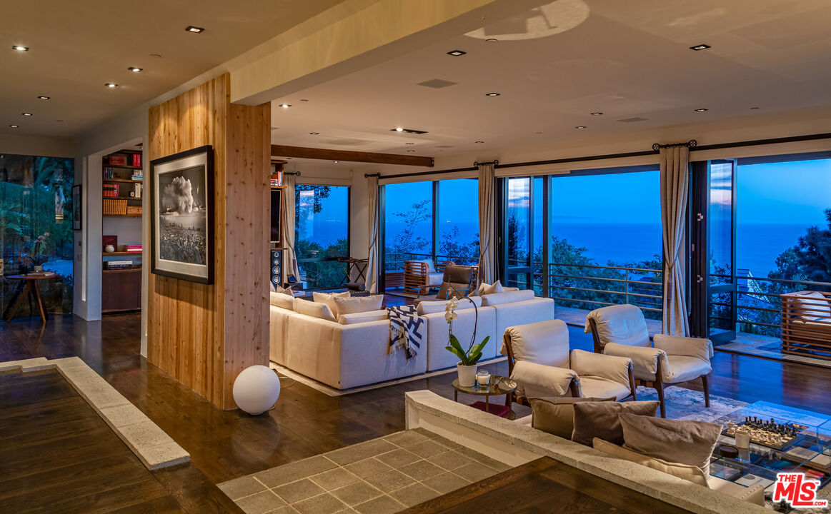 3900 Villa Costera Malibu, CA 90265 - Photo 10 of 43 a living room with furniture and a large window