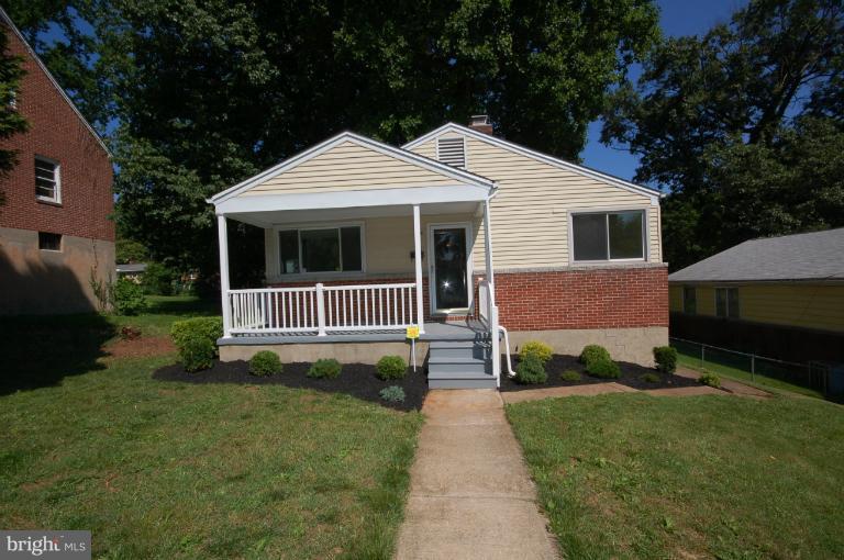 3612 Telmar Road Baltimore, MD 21207 - Photo 1 of 14 a front view of a house with a yard and trees