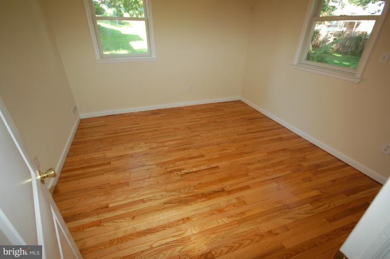 3612 Telmar Road Baltimore, MD 21207 - Photo 10 of 14 an empty room with windows