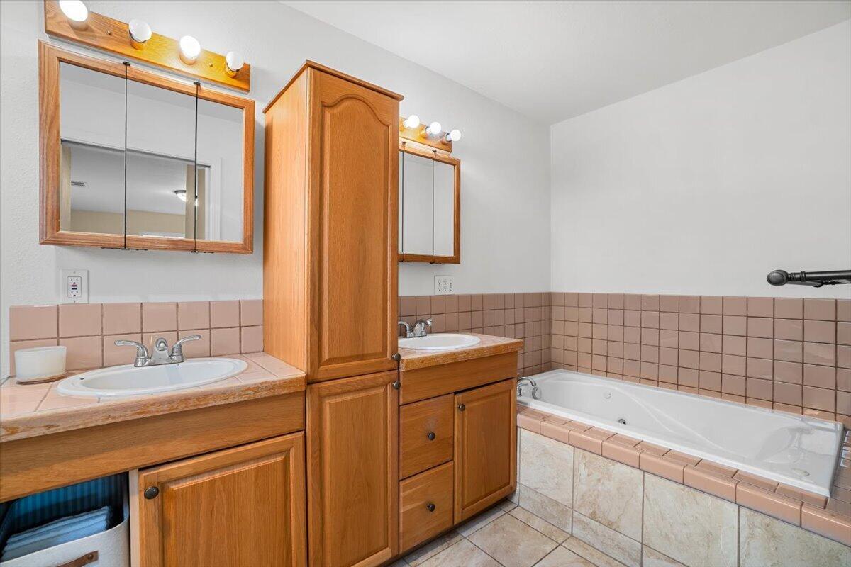 1196 Freshwater Road Eureka, CA 95503 - Photo 18 of 34 a bathroom with a tub sink and mirror