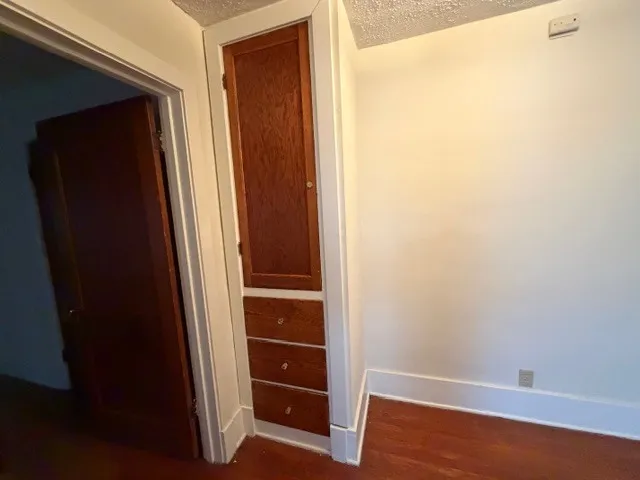 a view of front door with wooden floor