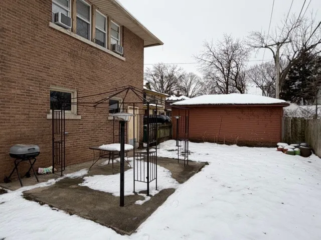 a view of house with backyard