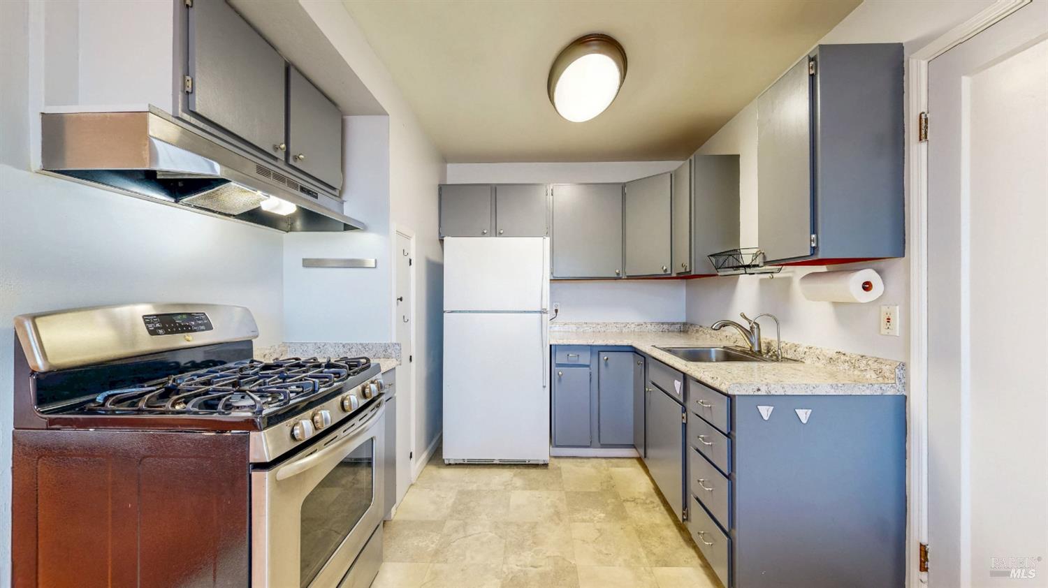 809 Maple Avenue Vallejo, CA 94591 - Photo 10 of 46 a kitchen with stainless steel appliances granite countertop a stove a sink dishwasher and a refrigerator