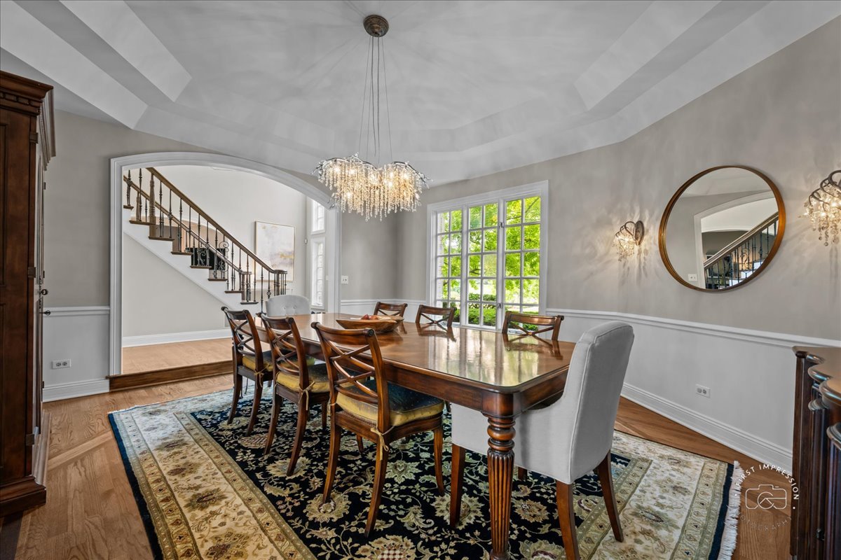 4N749 Old Farm Road St. Charles, IL 60175 - Photo 24 of 46 a view of a dining room with furniture and a chandelier