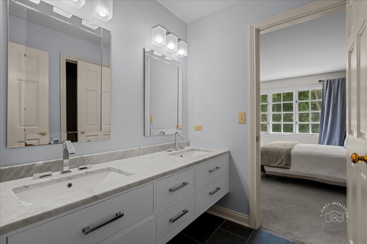 4N749 Old Farm Road St. Charles, IL 60175 - Photo 37 of 46 a bathroom with a double vanity sink and a mirror