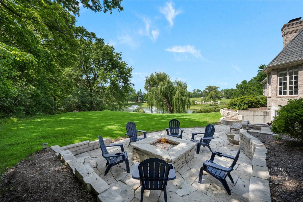 4N749 Old Farm Road St. Charles, IL 60175 - Photo 9 of 46 a view of a patio with table and chairs plants and large trees