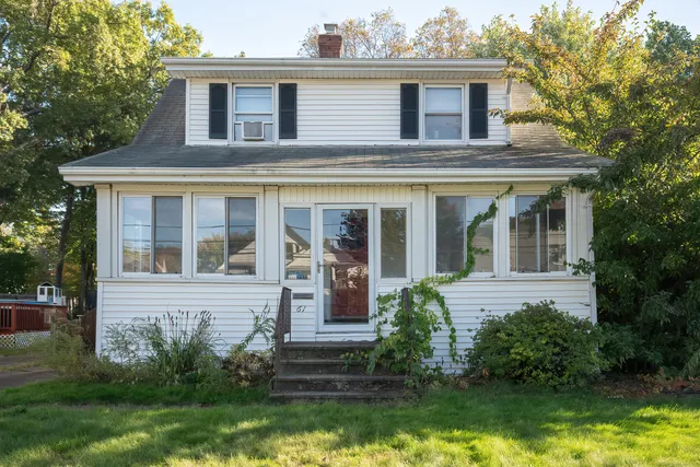 front view of a house that has a yard
