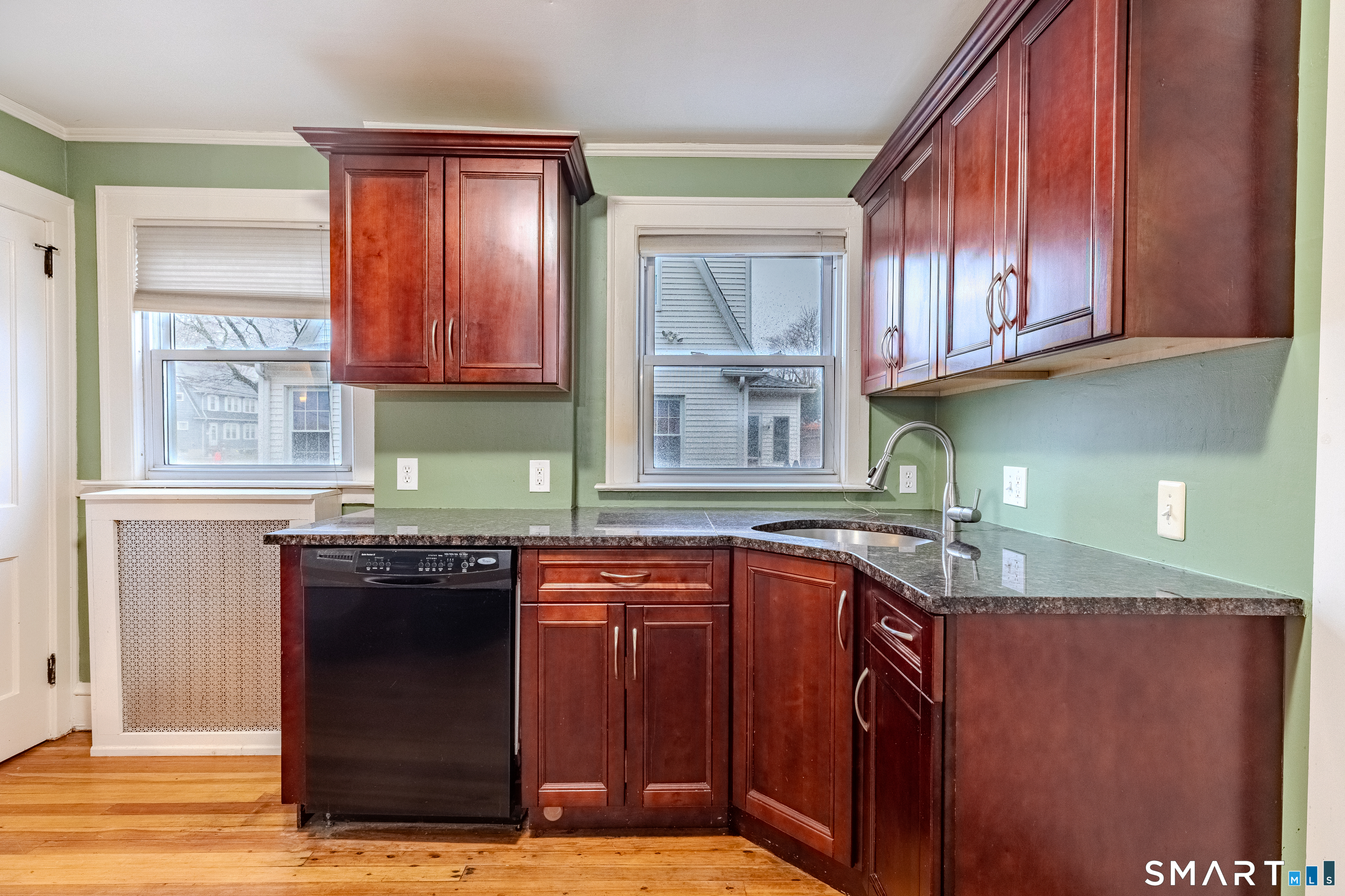61 Woodmere Road West Hartford, CT 06119 - Photo 13 of 37 a kitchen with stainless steel appliances granite countertop a sink stove and cabinets