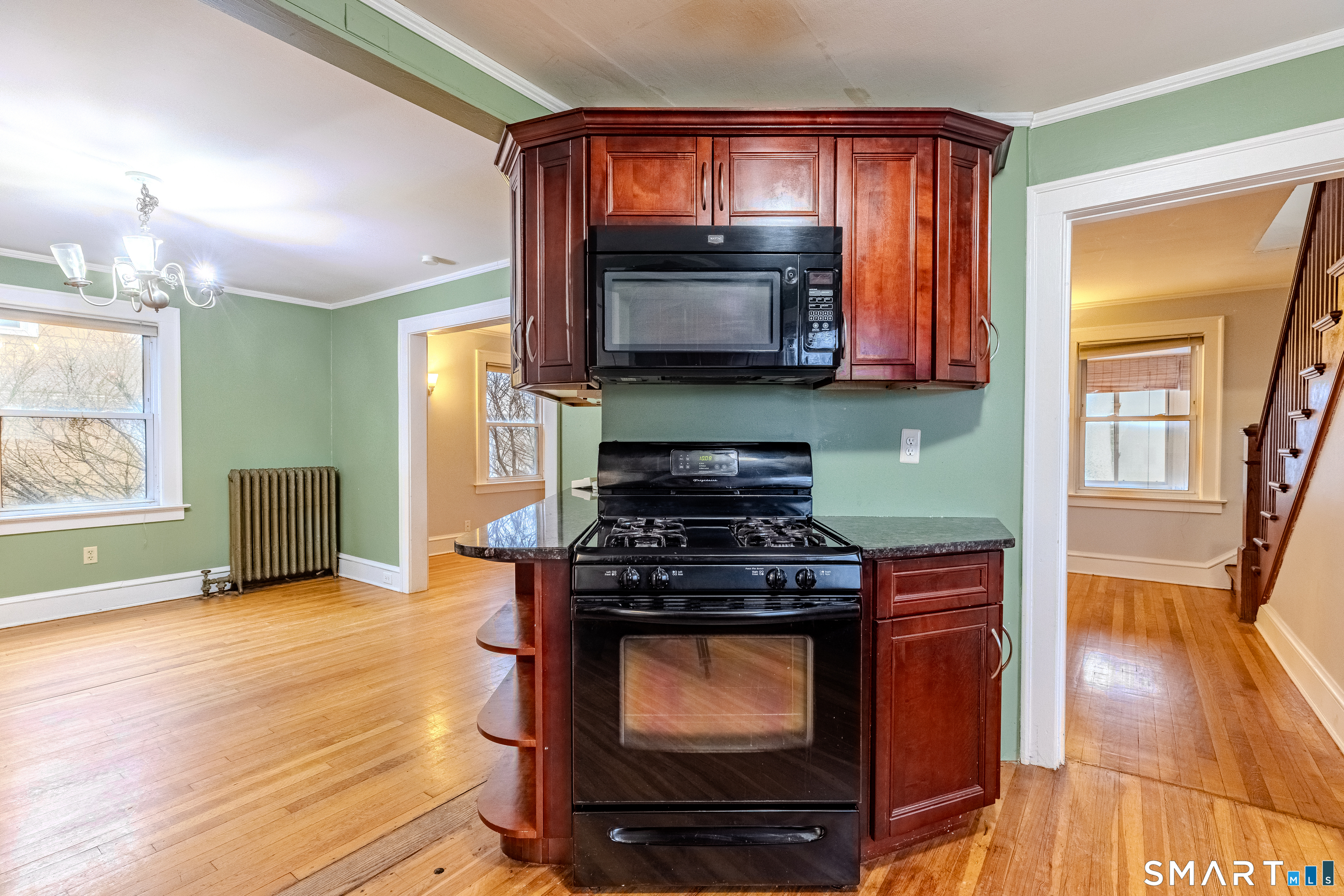 61 Woodmere Road West Hartford, CT 06119 - Photo 14 of 37 a kitchen with a stove and a microwave