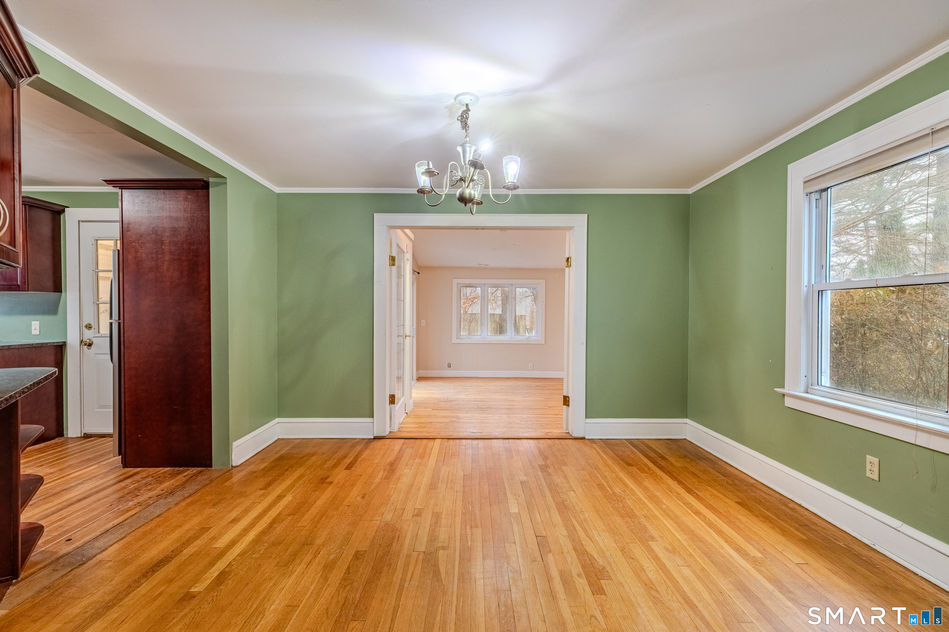 61 Woodmere Road West Hartford, CT 06119 - Photo 15 of 37 a bedroom with a bed and a window