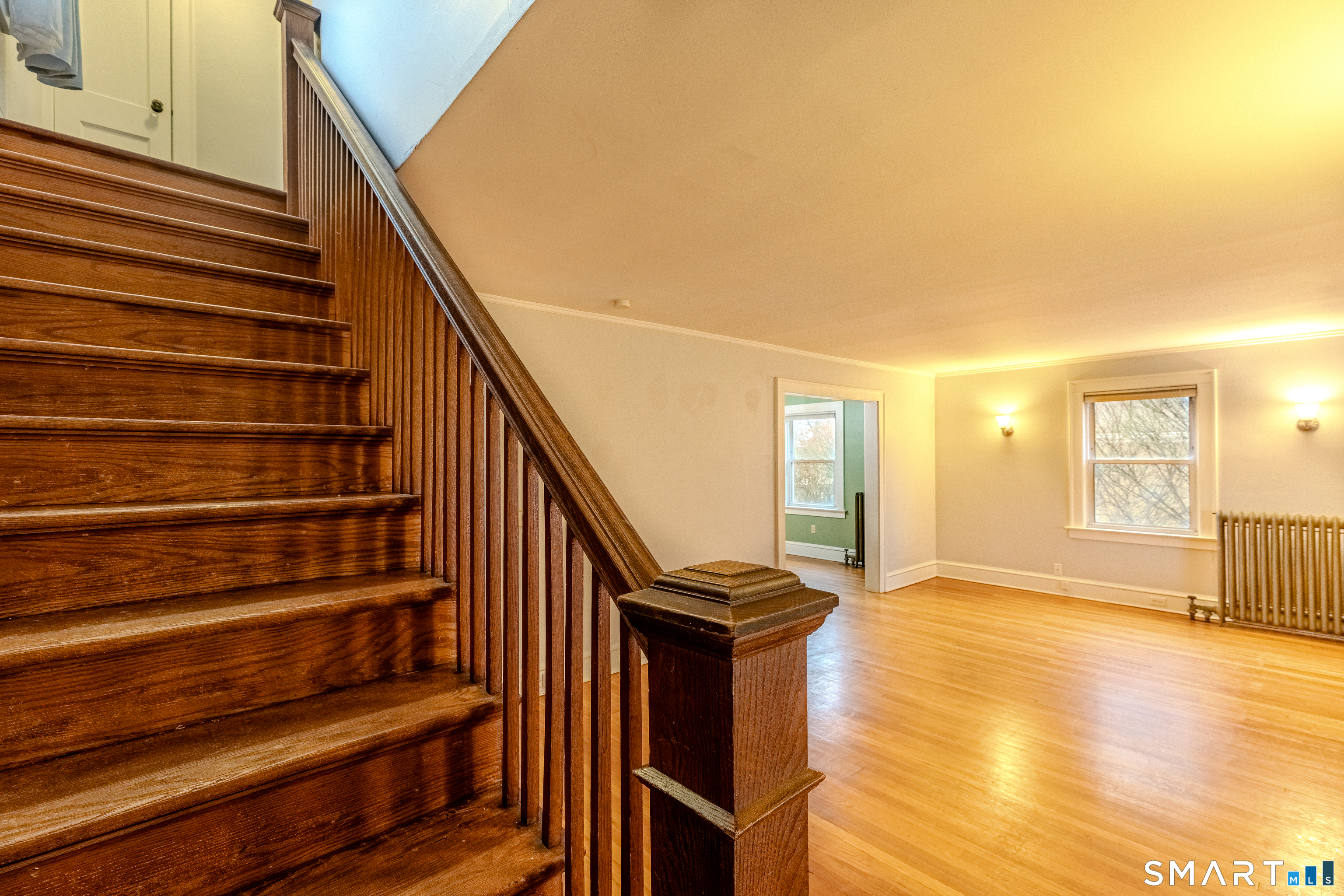 61 Woodmere Road West Hartford, CT 06119 - Photo 22 of 37 a view of entryway and hall with wooden floor