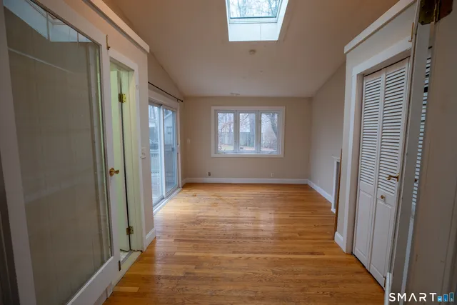 a view of an empty room with windows