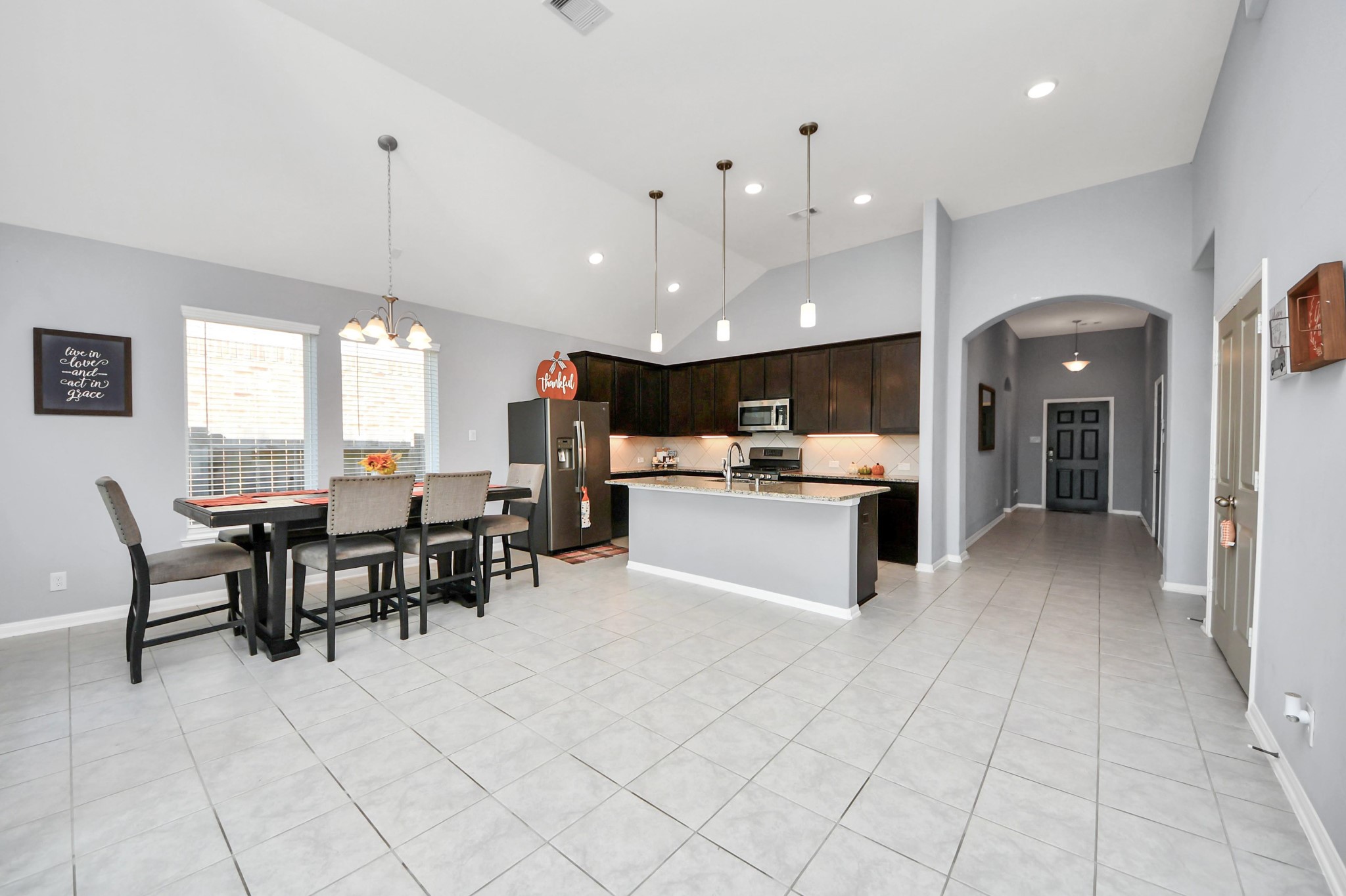 427 Alaska Cedar Drive Crosby, TX 77532 - Photo 15 of 35 a large kitchen with cabinets table and chairs