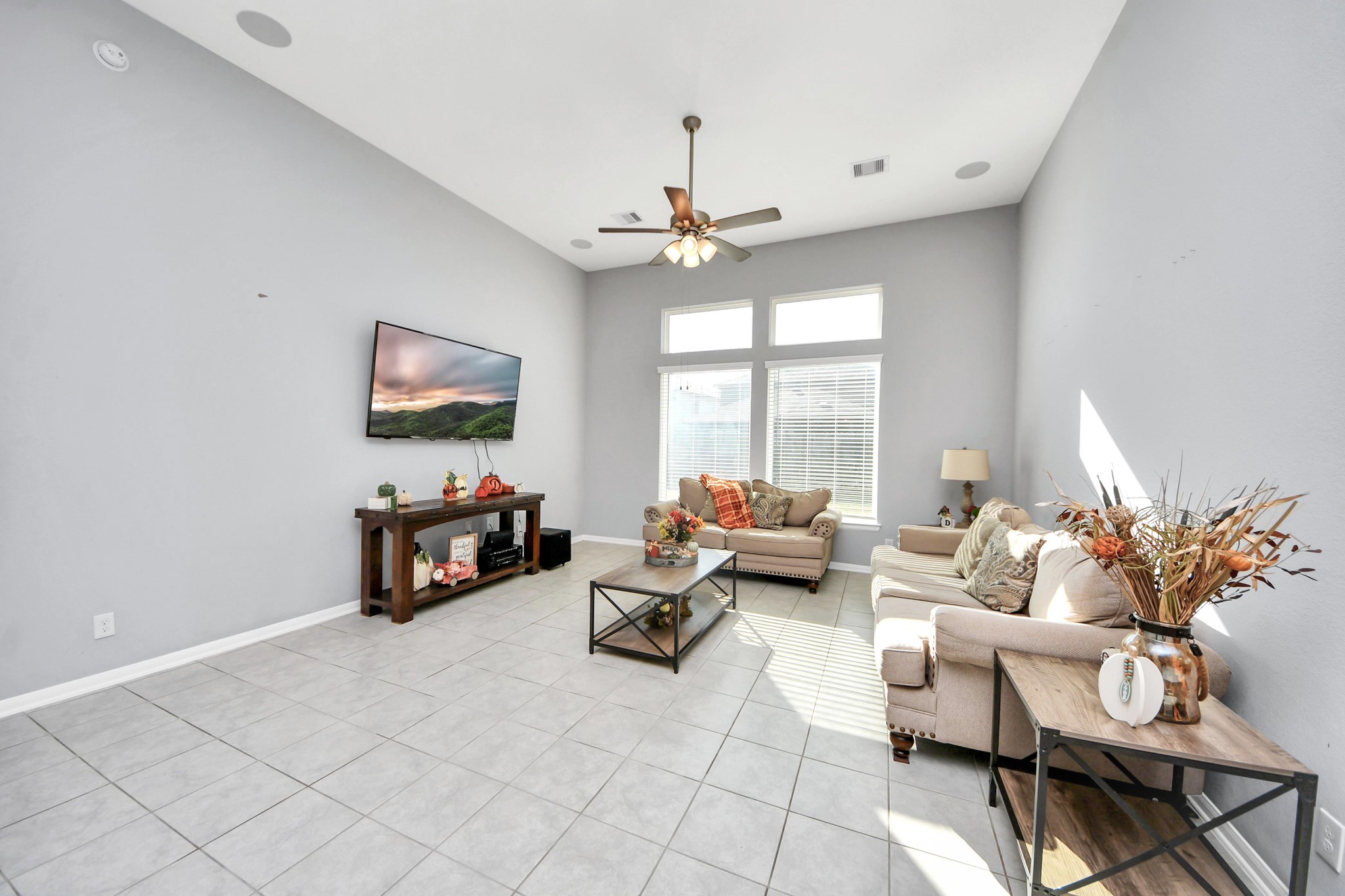 427 Alaska Cedar Drive Crosby, TX 77532 - Photo 19 of 35 a living room with furniture a flat screen tv and a large window