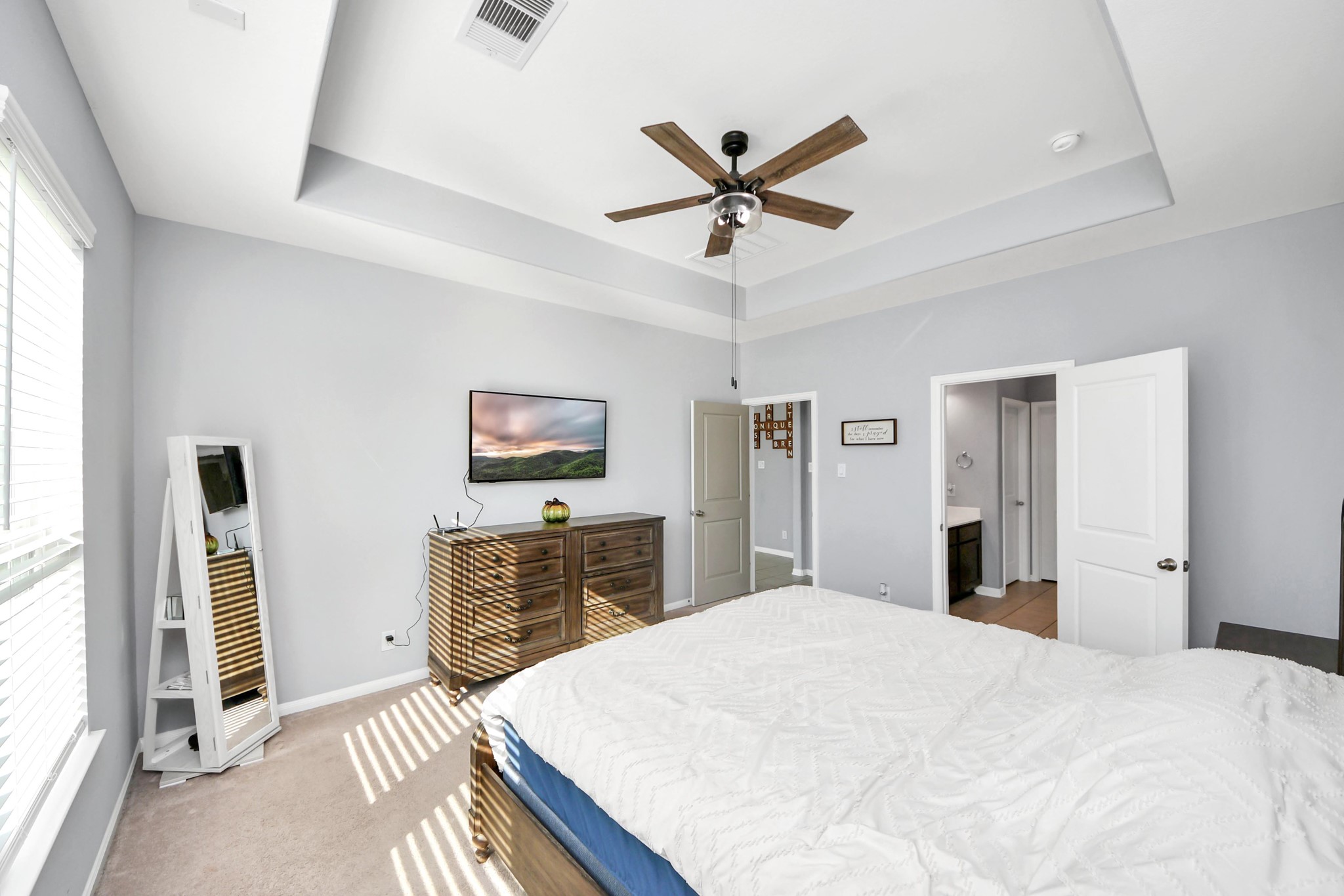 427 Alaska Cedar Drive Crosby, TX 77532 - Photo 22 of 35 a bedroom with a bed and a flat screen tv