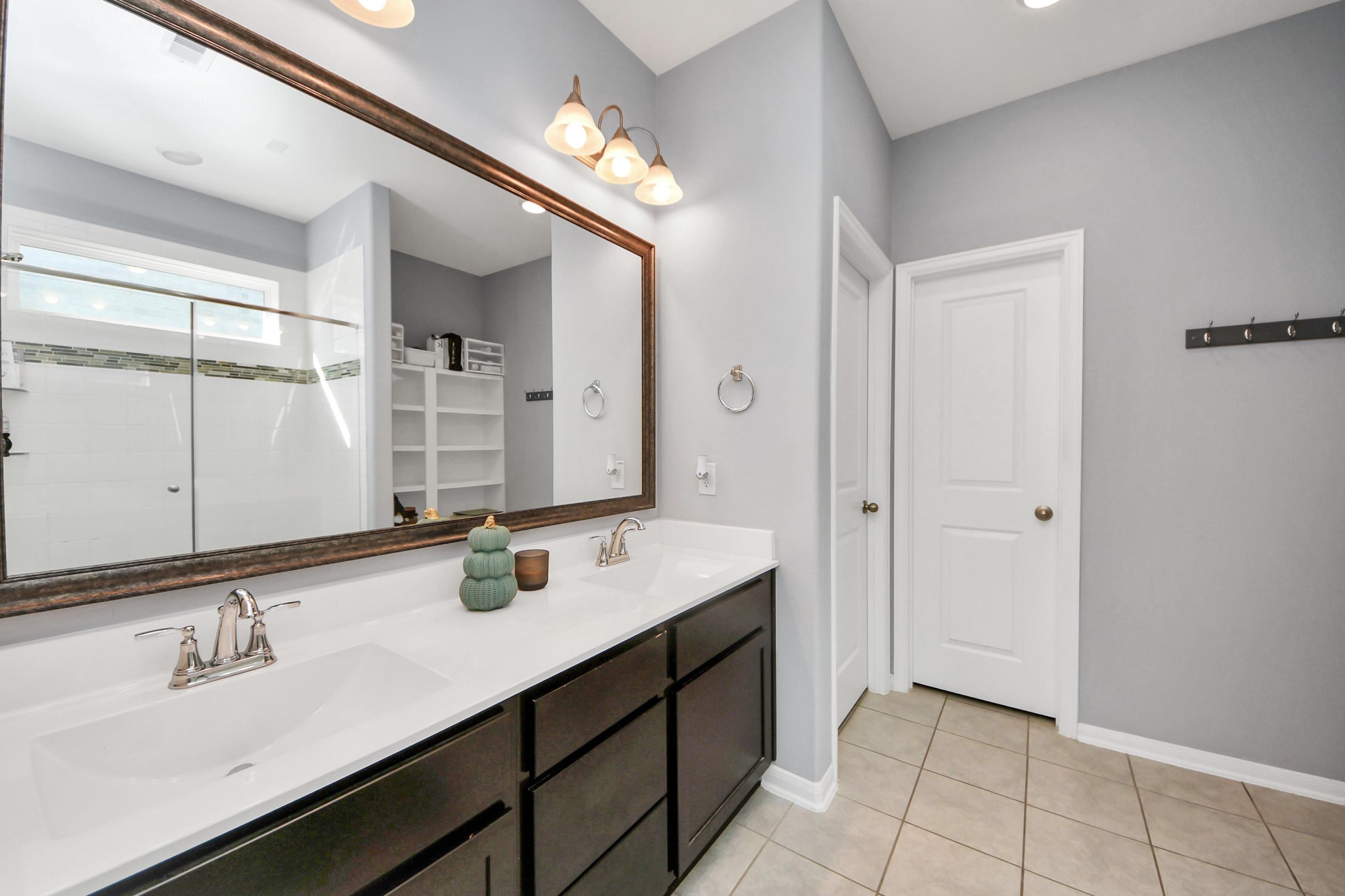 427 Alaska Cedar Drive Crosby, TX 77532 - Photo 25 of 35 a bathroom with a sink double vanity and a mirror