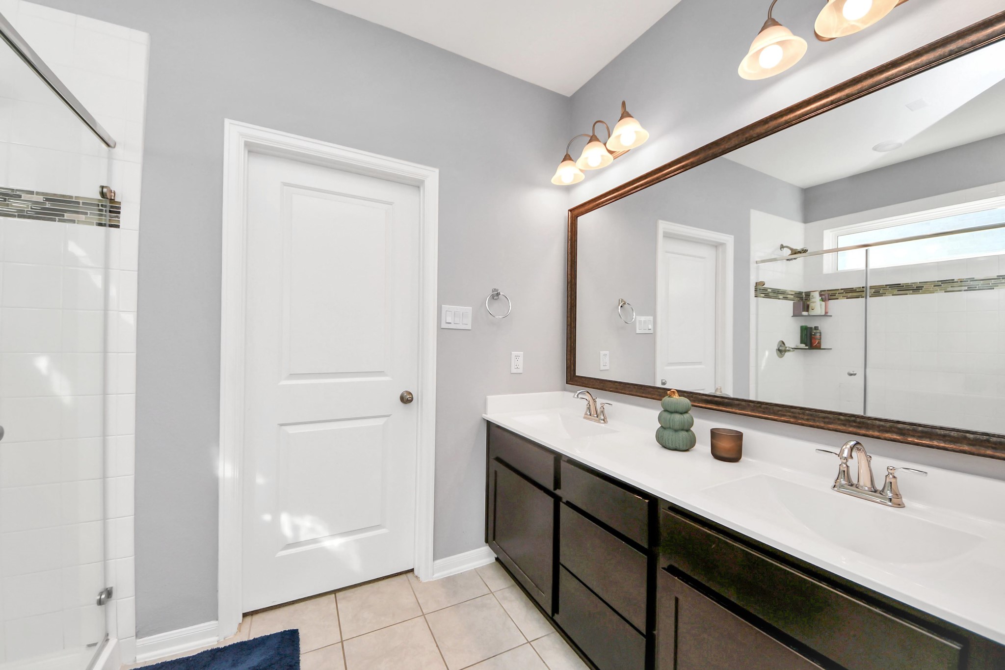 427 Alaska Cedar Drive Crosby, TX 77532 - Photo 27 of 35 a bathroom with a double vanity sink a and mirror