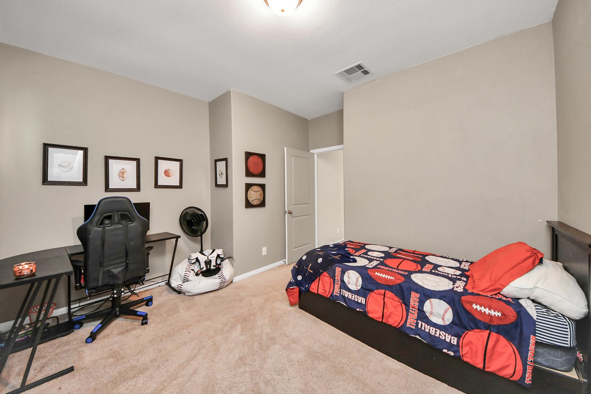 427 Alaska Cedar Drive Crosby, TX 77532 - Photo 10 of 35 a bedroom with a bed and gym equipment