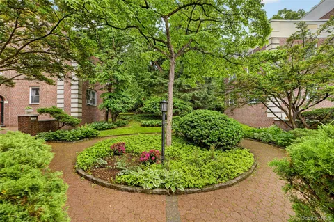 a view of a garden with a fountain