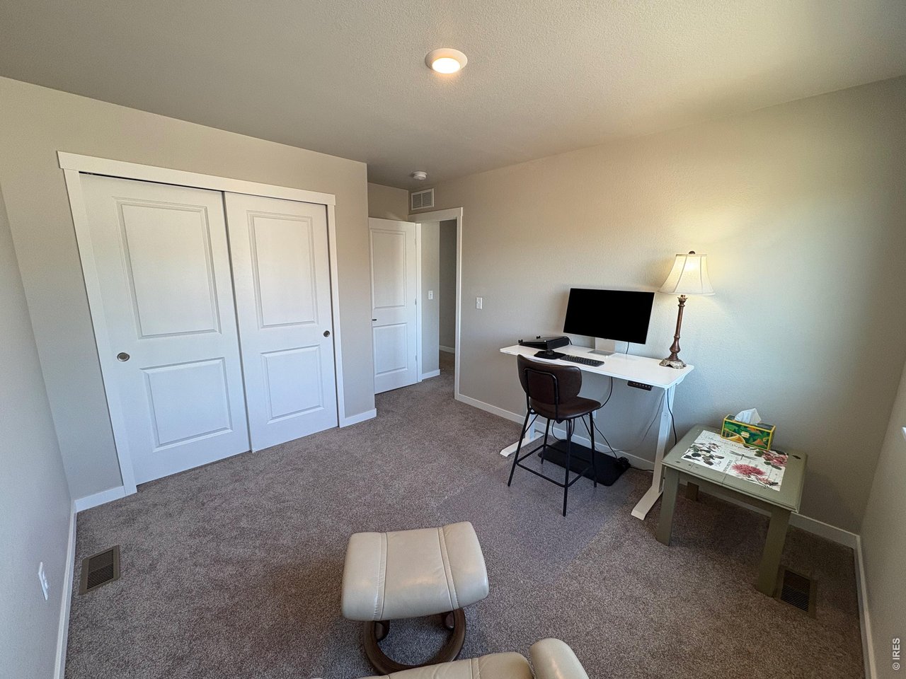 333 Pyramid Peak Street Berthoud, CO 80513 - Photo 18 of 21 a livingroom with workspace and a couch