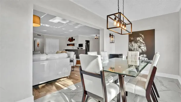 a dining room with furniture and window