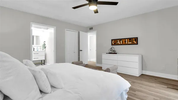 a bedroom with a bed and a dresser