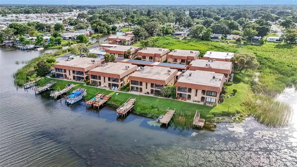 an aerial view of a building with garden space and street view