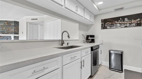 a kitchen with a sink and cabinets