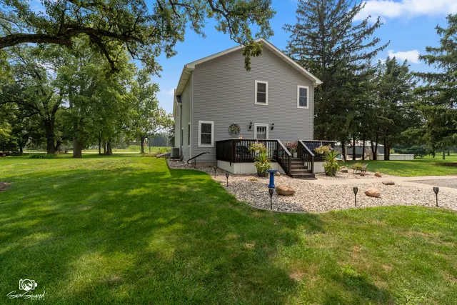 a view of a backyard with sitting area