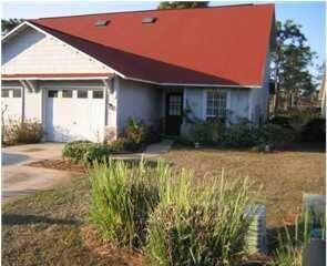 26 Vía Largo, Unit 3B Santa Rosa Beach, FL 32459 - Photo 1 of 1 a front view of a house with garden